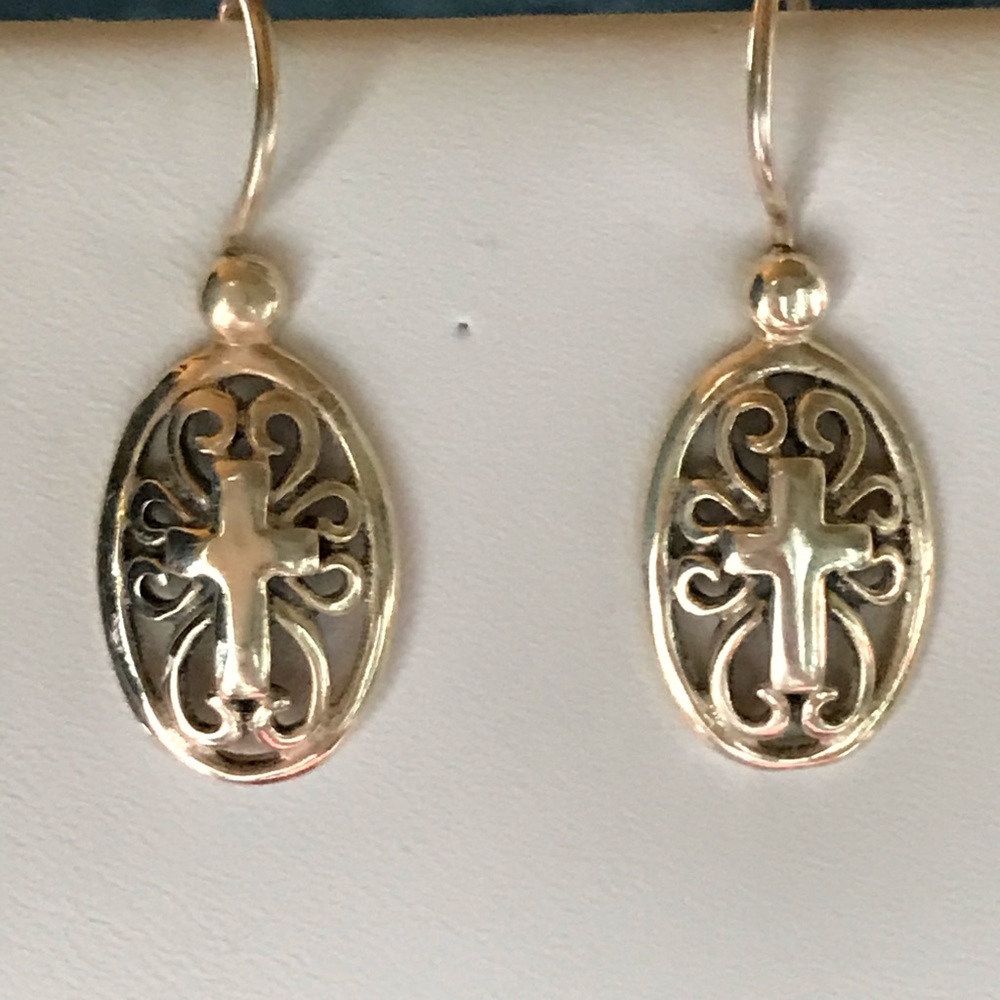 Oval With Cross In Center And Scroll Accents
